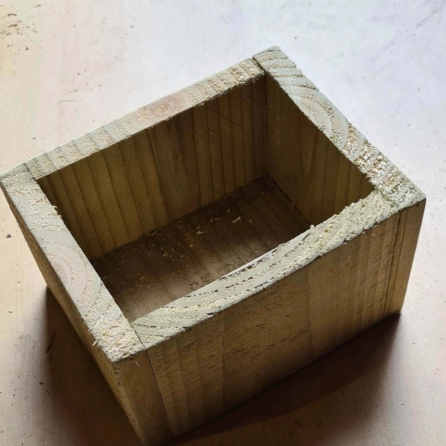 Table display planter made from wood, perfect for indoor plants or event decorations.