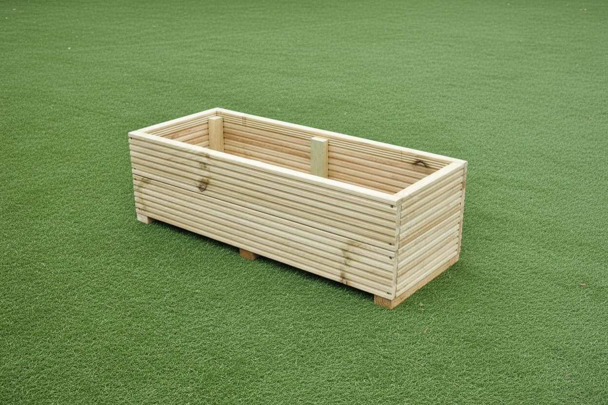 40cm Wide garden wooden decking planter on green grass.