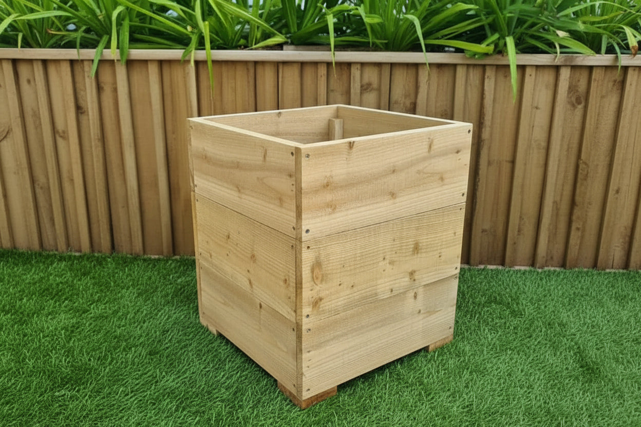 40cm Square wooden Planter in 3 heights displayed outdoors with green plants in the background.